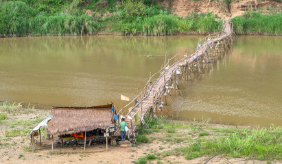 Bamboo bridge crossing the Nam Kahn River at its confluence with the Mekong River in Luang Prabang...