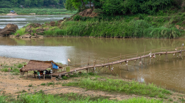Bamboo bridge crossing the Nam Kahn River at its confluence with the Mekong River in Luang Prabang Laos