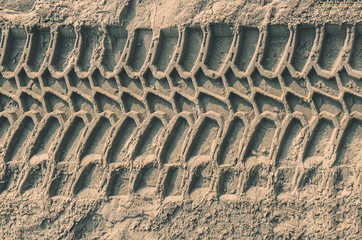 Car tyre tracks prints on sandy beach