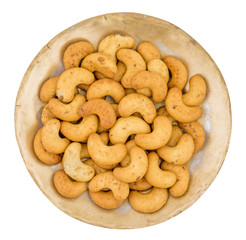 Salted Flavor Roasted Cashew Nut Snacks Served in Plate Also Know as in India Kaju Namkeen or Masala Kaju isolated on White Background