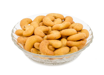 Salted Flavor Roasted Cashew Nut Snacks Served in Glass Bowl Also Know as in India Kaju Namkeen or Masala Kaju isolated on White Background