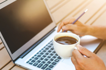 Asian young businessman working on his laptop. Digital Economy.