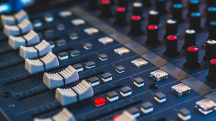 Fototapeta premium audio mixer, music equipment, recording, studio gears, broadcasting tools, mixer, synthesizer with shallow depth of field