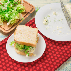 Vegetarian sandwich with salad and blue cheese on a wooden background. Healthy Diet