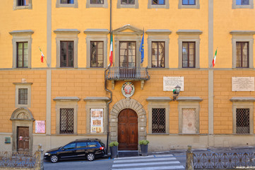 Fototapeta na wymiar The yellow facade of the Town Hall Palazzo Comunale - San Miniato, Tuscany, Italy