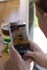 Cold coffee with mint leaves and ice cubes on the bar
