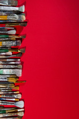 brush artist on colored canvas, old brush