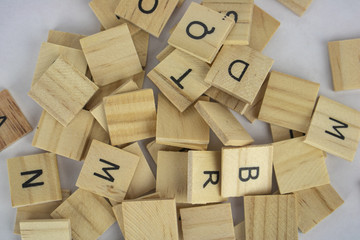 Wooden tiles with letters on an isolated white background