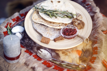 northern berries, bread cakes, covered table. Viking table