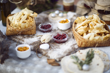 northern berries, bread cakes, covered table. Viking table