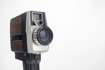 Vintage video camera on isolated bright white background