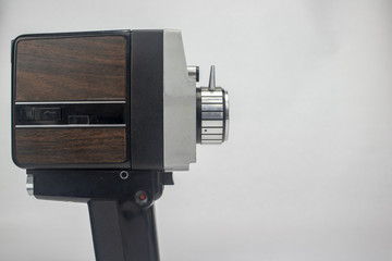 Vintage video camera on isolated bright white background