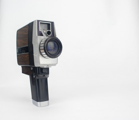 Vintage video camera on isolated bright white background
