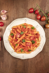 Penne pasta photo with tomato sauce and place for text