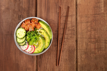 Hawaiian tuna poke salad with wakame and copy space