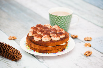 Tiramisu cake with candles and coffee