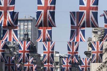 Fototapeta na wymiar Union Jack flags hang in Central London
