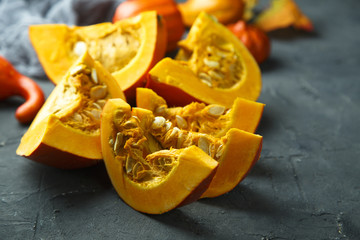 Fresh pumpkin on the dark background