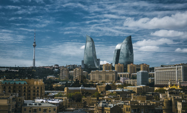 Brown concrete walls, Glass Flame and Sky. Make City alive forever. Welcome to Baku Azerbaijan