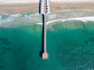 Long pier with houses and cars in San Diego California aerial