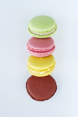 Sweet colorful macarons isolated on white background.