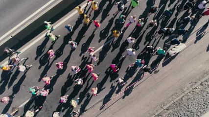 4K Aerial drone fooage. Marathon running on street. Top view close up rotate camera