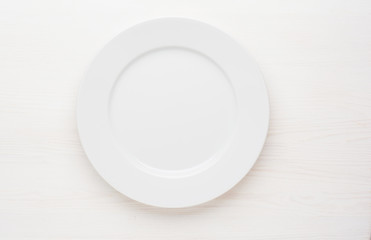 empty white plate on white background top view