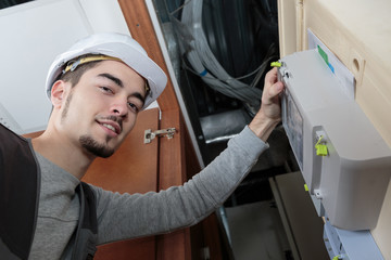 Portrait of man by electric meter