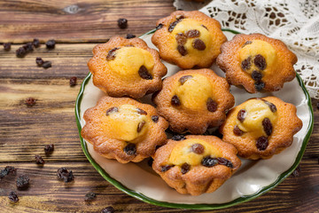 Traditional homemade French butter muffins stars with raisins, tasty dessert