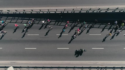 4K Aerial drone fooage. Marathon running on street. Group of athletes. Top view