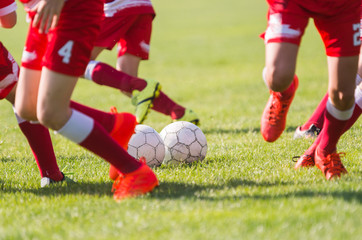 Obraz premium Young children players football match on soccer field