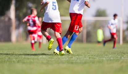 Young children players football match on soccer field