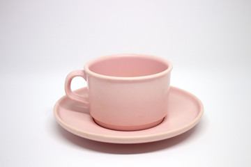 Pink teacup on white