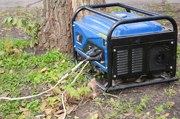 Fototapeta na wymiar Portable Diesel Generator for repair hurricane damage. Portable Diesel Generator for house repair.