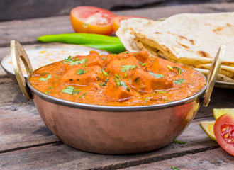 Indian Delicious Cuisine Paneer Tikka Masala With Tandoori Chapati Also Called Paneer Butter Masala is an Indian Dish of Marinated Paneer Cheese Served in a Spiced Gravy on Wooden Background