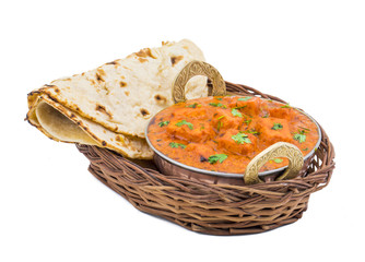 Indian Delicious Cuisine Paneer Tikka Masala With Tandoori Chapati Also Called Paneer Butter Masala is an Indian Dish of Marinated Paneer Cheese Served in a Spiced Gravy isolated on White Background