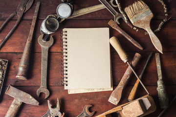 Vintage Work Tool, Notebook on Dark Wooden Background. Concept Father's Day. Flat lay, top view