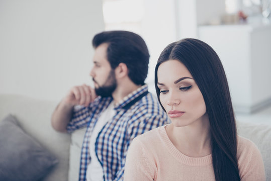 Portrait of upset couple having conflict unhappy girl sitting ignore her boyfriend after scandal they do not speak with each other having distrust disrespect negative emotions