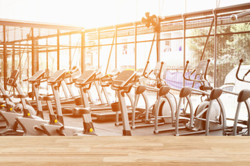Empty top of fitness gym and wooden deck tabletop.For product display