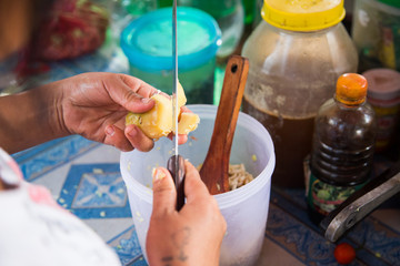 Obraz na płótnie Canvas cutting potatoes asian cuisine food truck