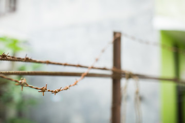 Barbed wire closeup old rusty metal fence