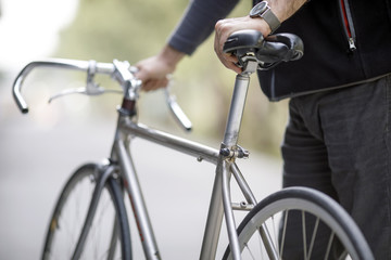 Obraz premium Man Holding Bike