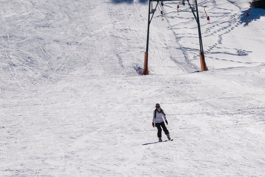 Woman skiing at Ziria mountain in Greece.