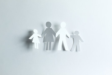 happy paper family on a paper background.