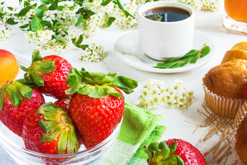 continental breakfast: coffee, strawberry and cream, croissant and juice