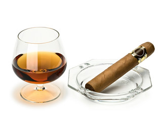 Cognac and cigar in a glass ashtray