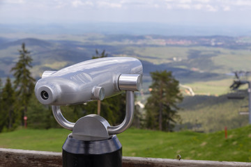 Public tourist binoculars lookout on the top