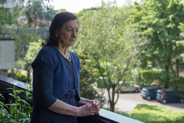 80 years old woman on the balcony