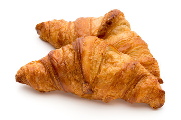Tasty buttery croissants on the white background.