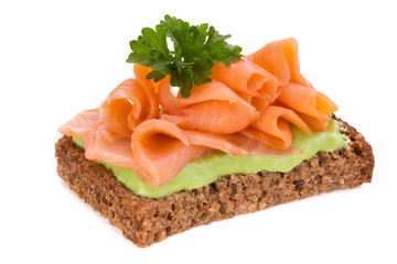 Bread with fresh salmon fillet isolated on white background, top view.